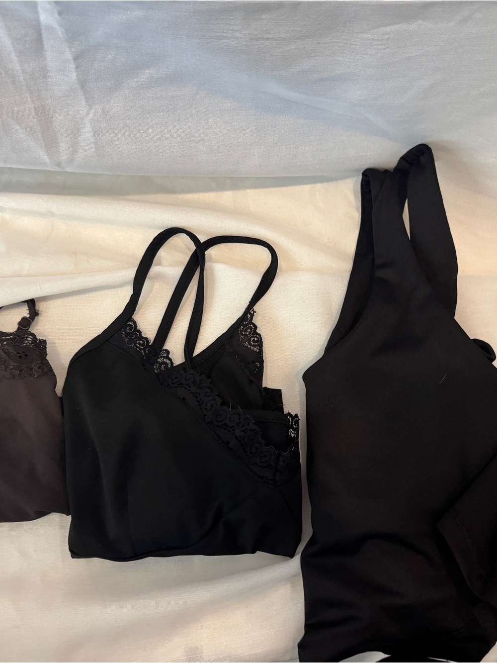 4 tops / camis. 3 black, one brown.